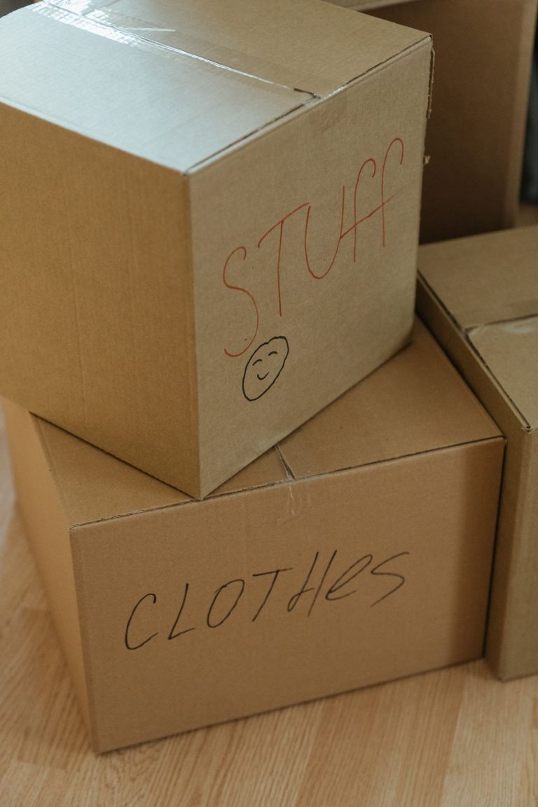Two labelled cardboard cartons taped and stacked ready to ship