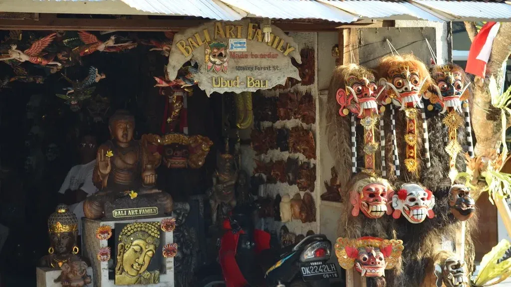 Barong masks and carved figures filling a stall at Ubud Art Market